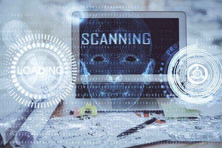 Double exposure of desktop computer and technology theme hologram. Concept of software development.