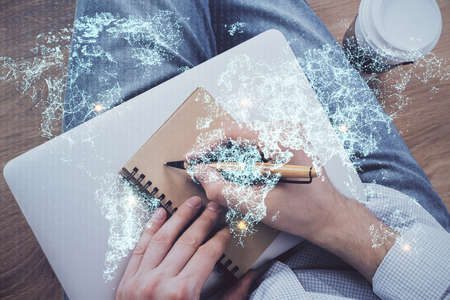 Mans hands working with notes background. Social networking scheme . Mixed media. Global business. Multi exposure.の写真素材