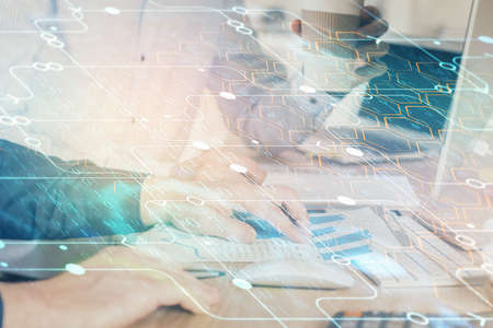 Double exposure of technology hologram with man working on computer background. Concept of big data.