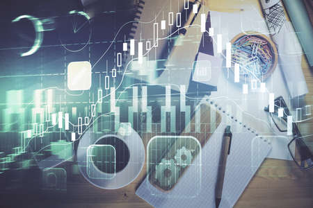 Double exposure of forex graph drawing and work table top veiw. Concept of financial analysis.