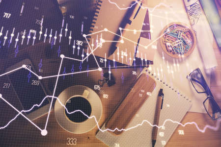 Double exposure of forex graph drawing and work table top veiw. Concept of financial analysis.の写真素材