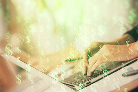 Double exposure of woman hands typing on computer and forex chart hologram drawing. Stock market...
