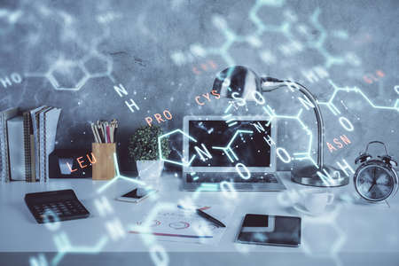 Desktop computer background and formula hologram writing. Double exposure. Education concept.の写真素材