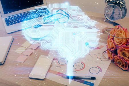 Double exposure of desktop with computer and brain drawing hologram. Artificial intelligence...