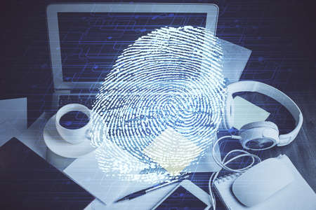 Computer on desktop in office with finger print drawing. Double exposure. Concept of business data...