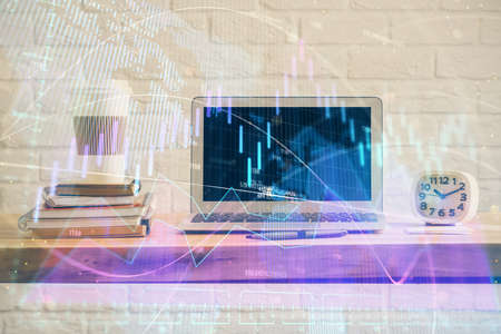 Stock market graph and table with computer background. Multi exposure. Concept of financial analysis.の写真素材