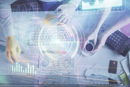 Double exposure of man and woman working together and data theme hologram drawing. Computer...