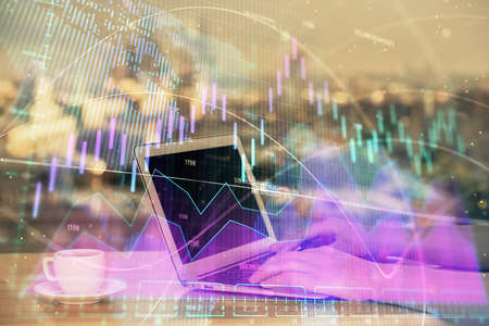 Double exposure of businesswoman hands typing on computer and forex chart hologram drawing....
