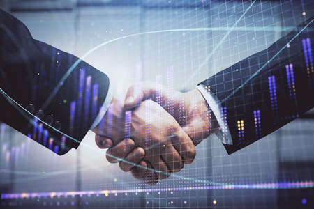 Double exposure of forex graph hologram and handshake of two men. Stock market concept.