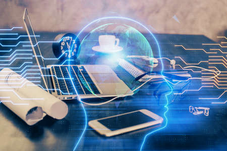 Double exposure of desktop with computer and brain drawing hologram. Artificial intelligence...