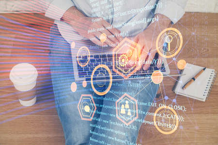 Multi exposure of technology hologram with man working on computer background. Concept of big data.