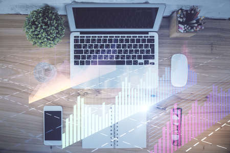 Multi exposure of financial chart drawing over table background with computer. Concept of research....