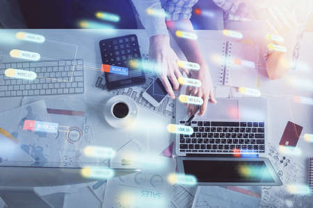 Double exposure of man and woman working together and data theme hologram drawing. Computer...