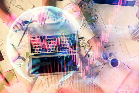 Double exposure of man and woman working together and financial theme hologram. international...