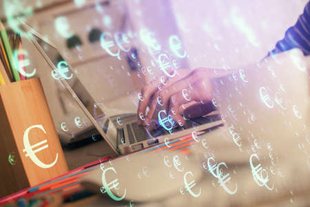 Double exposure of woman hands typing on computer and forex chart hologram drawing. Stock market...