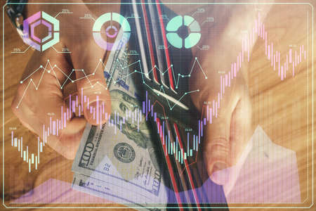 Multi exposure of forex graph drawing hologram and USA dollars bills and man hands. Technical...