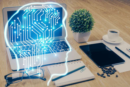 Double exposure of desktop with computer and brain drawing hologram. Artificial intelligence concept.の写真素材