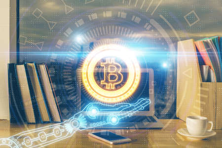 Multi exposure of blockchain theme hologram and table with computer background. Concept of bitcoin crypto currency.の写真素材