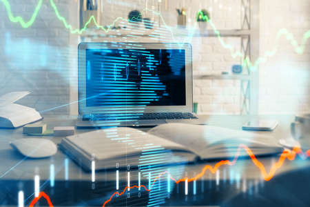 Forex market graph hologram and personal computer on background. Double exposure. Concept of...