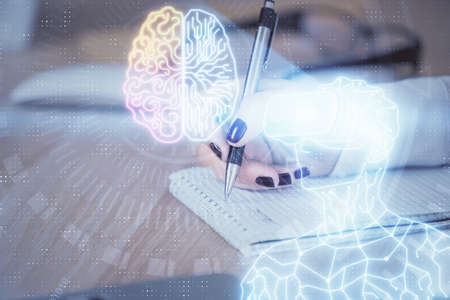 AR hologram over hands taking notes background. Concept of augmented reality. Double exposure