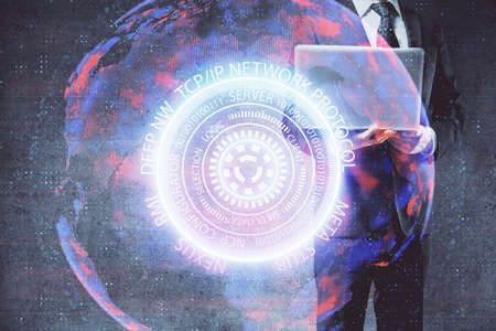 Technology theme hologram with man working on computer on background. High tech concept. Multi...