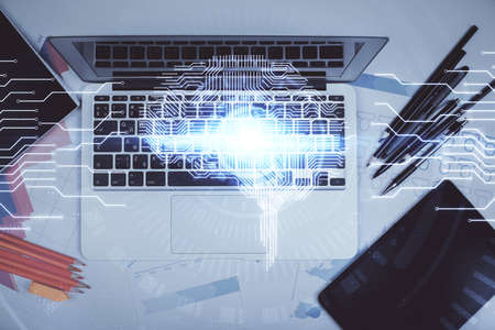 Multi exposure of brain sketch hologram over topview work table background with computer. Concept of...