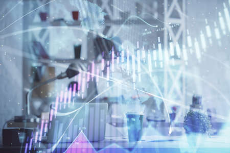Double exposure of stock market graph drawing and office interior background. Concept of financial...