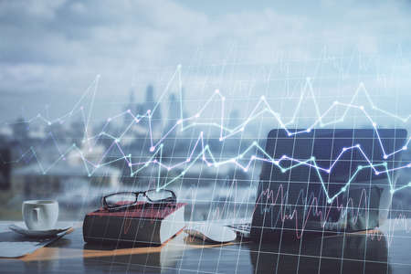 Double exposure of financial chart drawings and desk with open notebook background. Concept of forex...