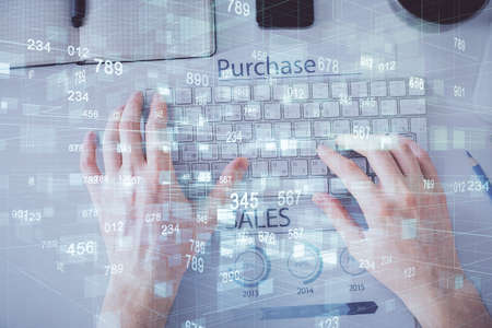 Multi exposure of man's hands typing over computer keyboard and data theme hologram drawing. Top...