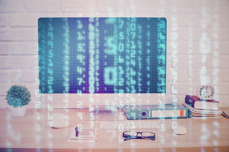 Double exposure of table with computer on background and data theme hologram. Data technology...