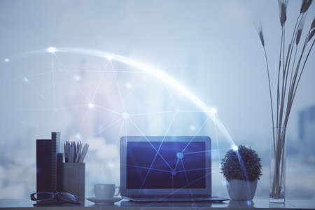 Computer on desktop with social network hologram. Double exposure. Concept of international people...