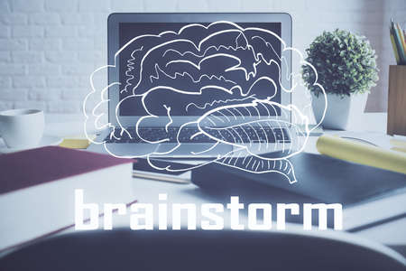 Desktop computer background in office and start up theme hologram drawing. Double exposure. Startup concept.の写真素材