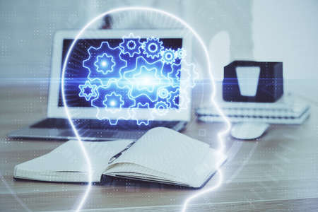 Multi exposure of work space with computer and human brain hologram. Brainstorm concept.