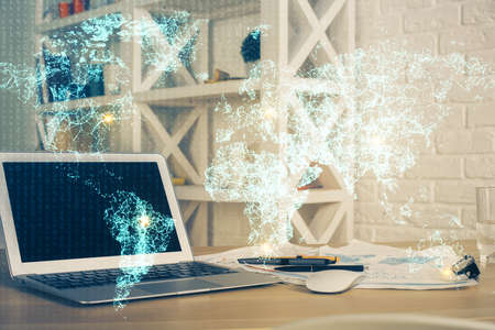 Computer on desktop with social network hologram. Multi exposure. Concept of international people connections.の写真素材