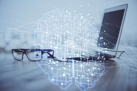 Multi exposure of work table with computer and brain hologram. Brainstorm concept.