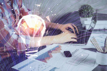 Growing arrows with businessman working on computer on background. Success concept. Double exposure.の写真素材