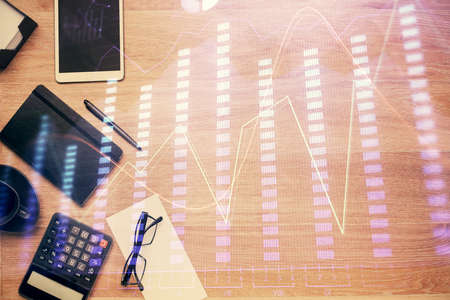 Double exposure of forex graph drawing and work table top veiw. Concept of financial analysis.の写真素材