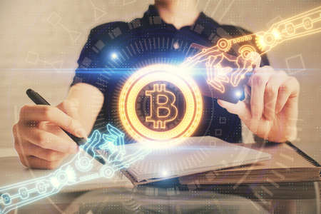 Double exposure of man hands holding a credit card and crypto business theme drawing. Digital...