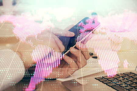 Double exposure of man's hands holding and using a phone and international business theme drawing.