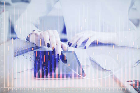 Double exposure of forex chart sketch hologram and woman holding and using a mobile device....