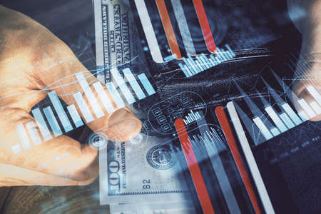 Multi exposure of forex graph drawing hologram and USA dollars bills and man hands. Technical Analysis concept.の写真素材