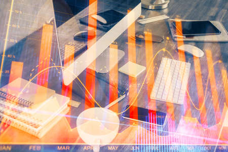 Multi exposure of chart and financial info and work space with computer background. Concept of...