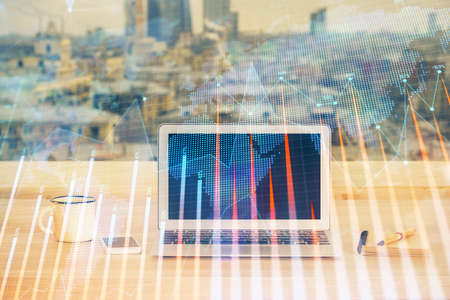 Double exposure of forex chart and work space with computer. Concept of international online trading.の写真素材