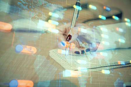 Multi exposure of woman's writing hand on background with data technology hud. Concept of innovation.の写真素材
