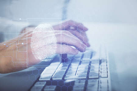 Fingerprint hologram with businessman working on computer on background. Security concept. Double...