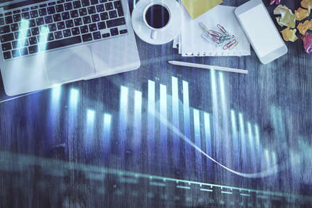 Stock market chart and top view computer on the table background. Multi exposure. Concept of...