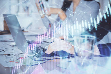 Multi exposure of woman hands typing on computer and forex chart hologram drawing. Stock market...