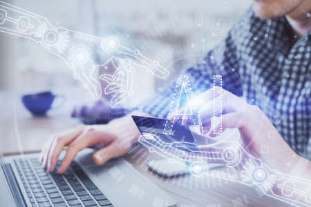 Double exposure of man hands holding a credit card and data theme drawing. E-commerce and technology...