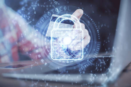 Double exposure of man hands holding a credit card and lock drawing. E-commerce and technology security concept.の写真素材