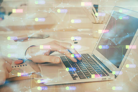 Businessman working on Laptop with technology theme drawing. Concept of big data. Double exposure.の写真素材